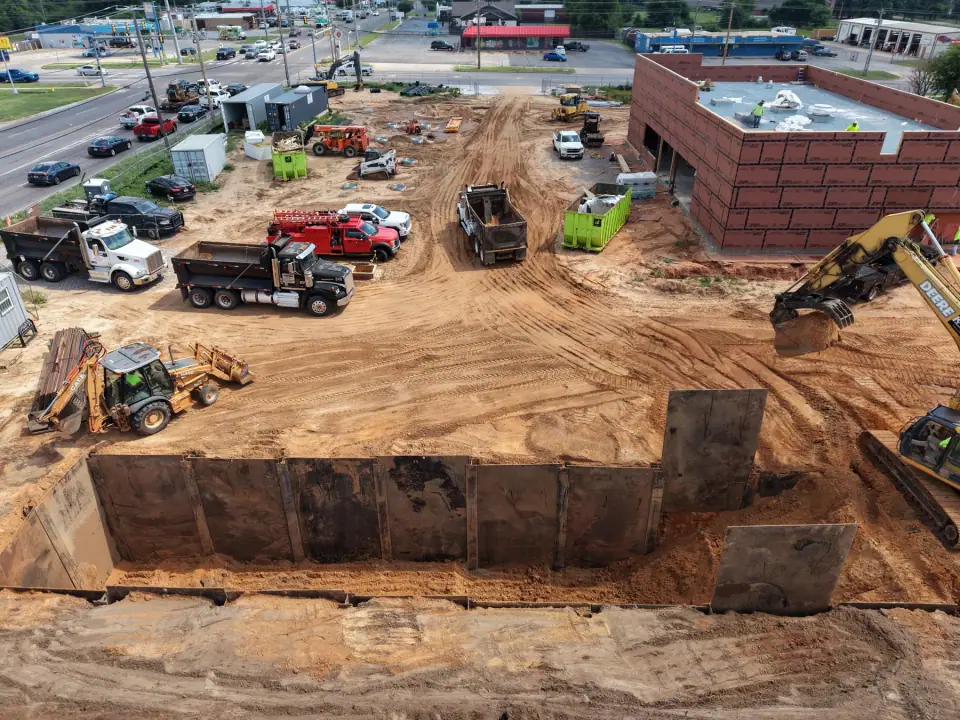 Steel shoring installed along the tank excavation