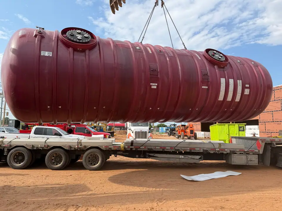 Underground storage tank lifted off the trailer