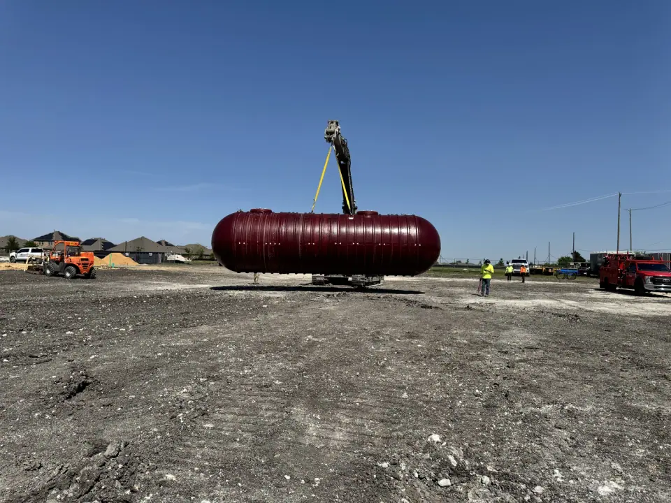 Tank lifted across the open site