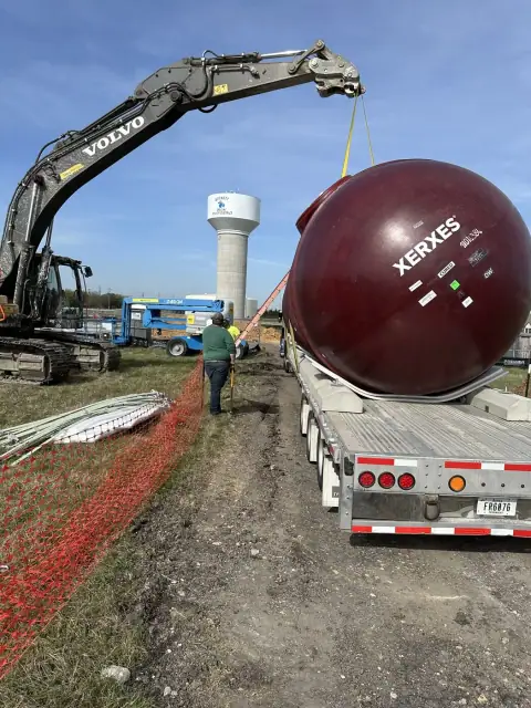 Tank arriving on a flatbed trailer