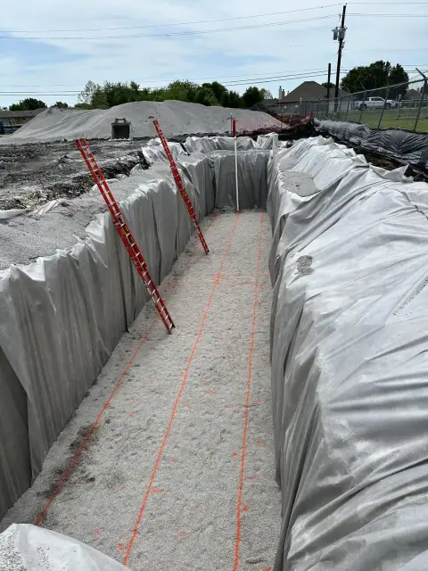 Lined tank excavation with bedding placed