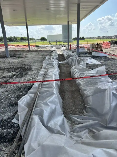 Piping trench beneath the canopy