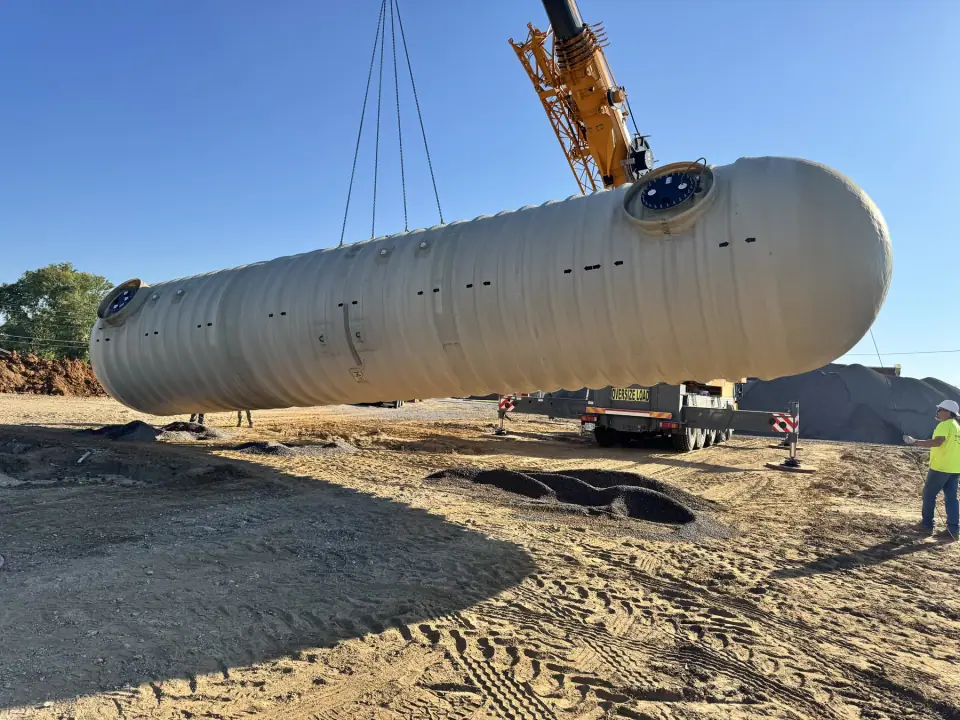 Fiberglass tank suspended over the site