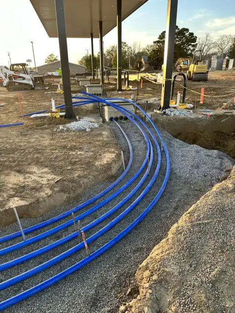 Product piping laid in the trench beneath the canopy