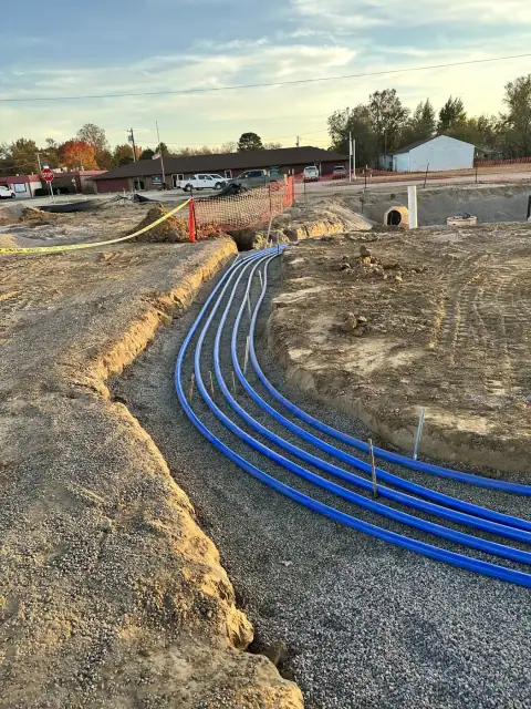 Curved product piping runs in the trench
