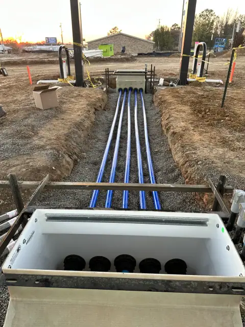 Product piping entering a dispenser sump