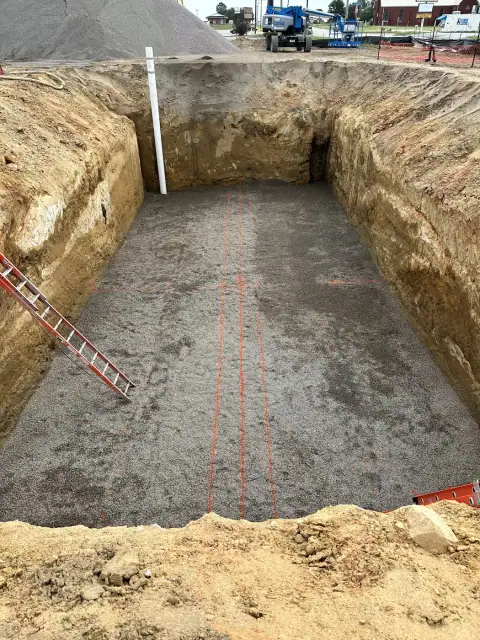 Excavated tank pit with bedding placed