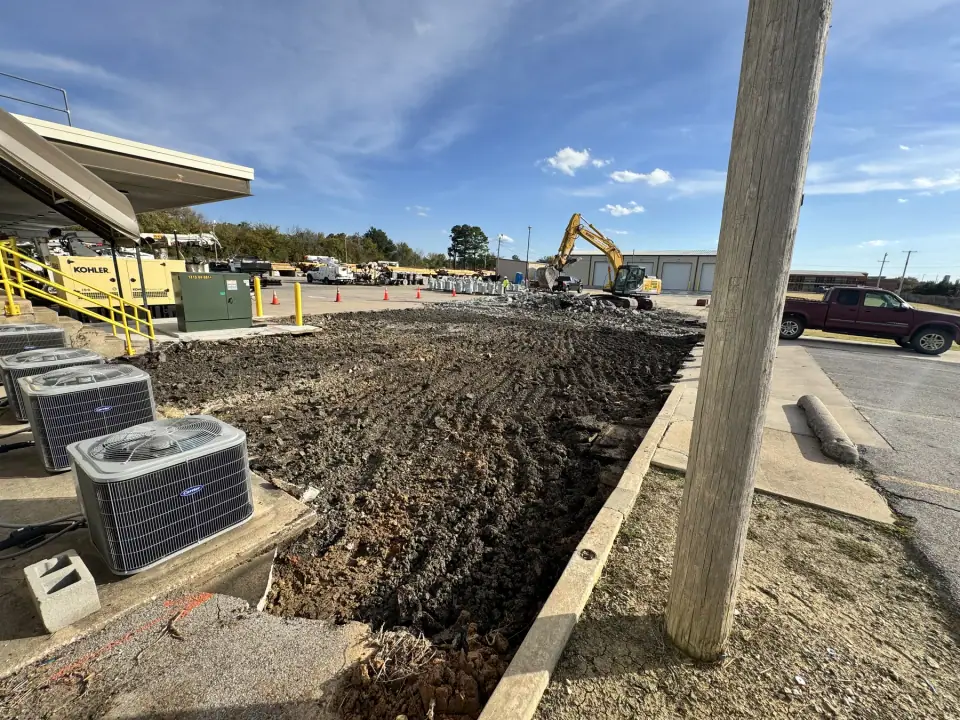 Excavated area along the building after concrete removal