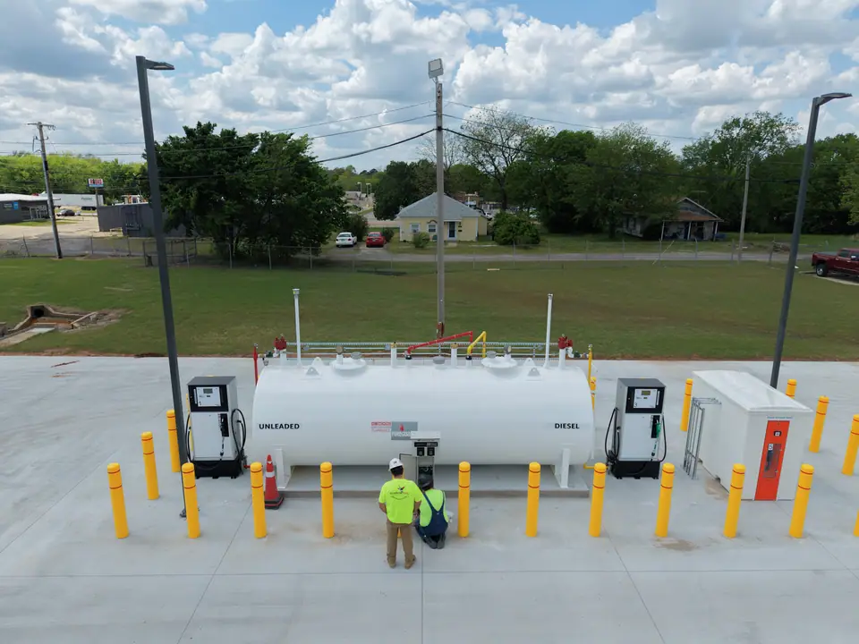 Technician at a completed fleet fueling island