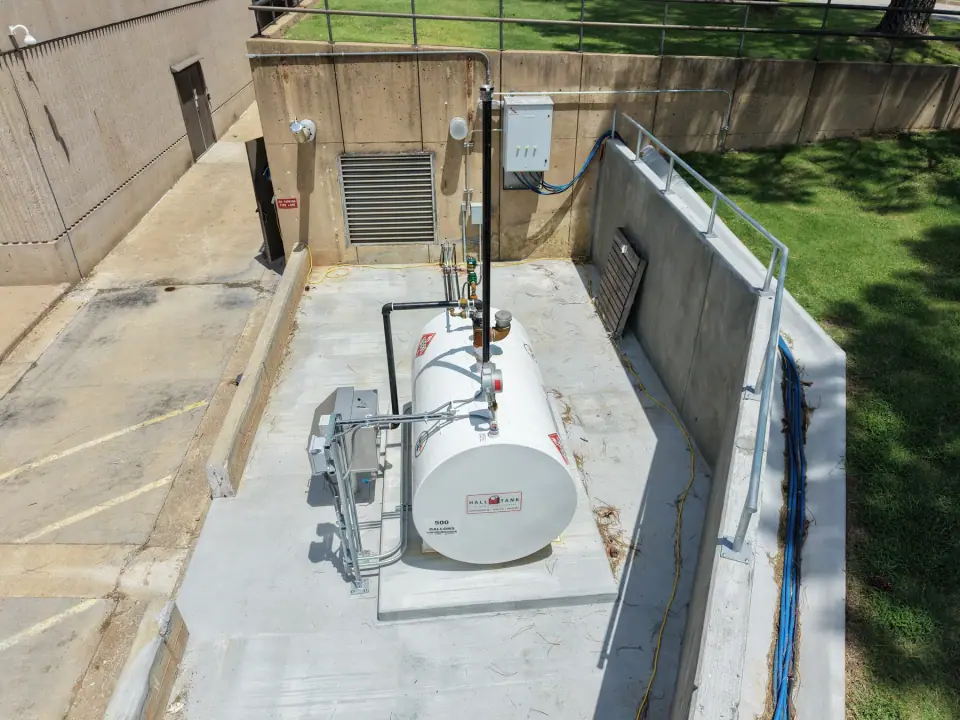 Aboveground tank with piping and monitoring equipment in the containment area