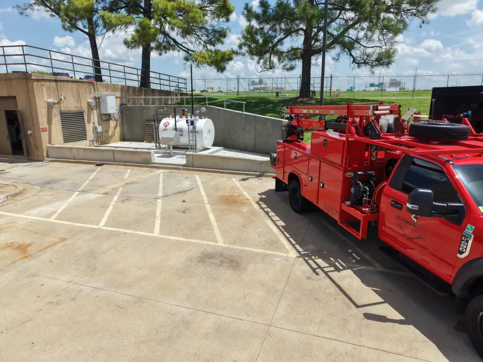 Containment area with the new tank and a Scissortail service truck