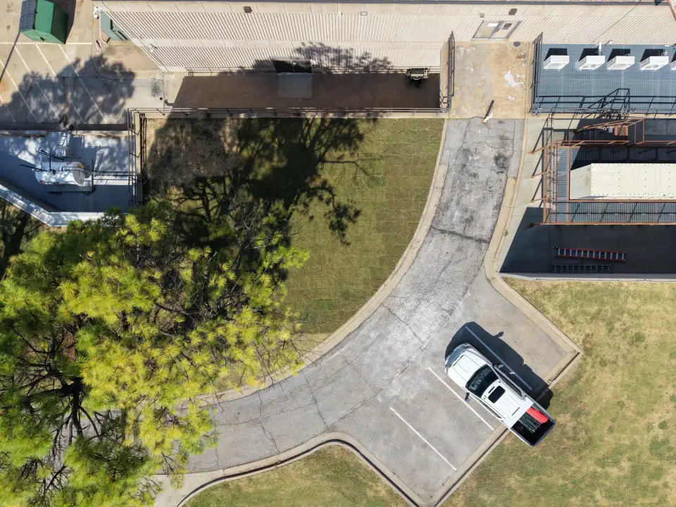 Restored area after the removal, with new sod and pavement